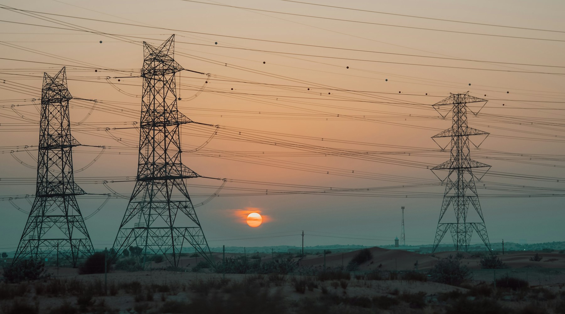 Electric transmission towers at sunset